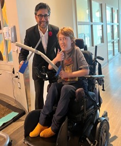 PS Yasir Naqvi with a patient at Roger Neilson Children's Hospice